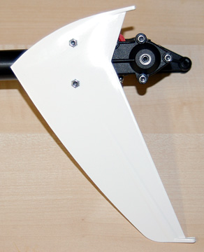 Press two lock nuts into the fin and bolt it to the tail unit housing using the two longer hex bolts.