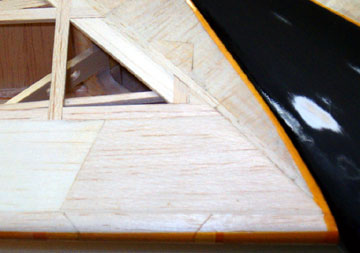 Miscellaneous pieces are added and the wing is sanded smooth.