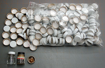 A bag of 28 mm screw-on bottle caps.