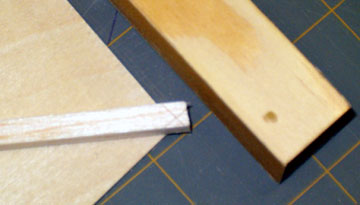 Align the brace over the correct corner of the sanding template.
