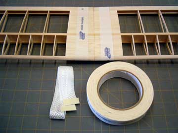 Use low tack masking tape to help align the fiberglass tape.