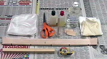 Materials and tools used to apply fiberglass.