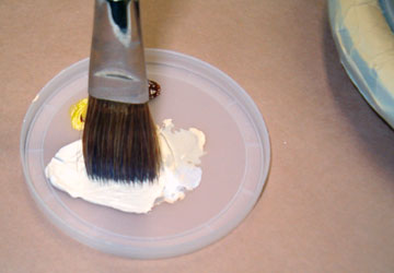 Dip just the end of the brush in the paint.