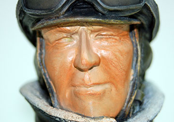 Burnt Sienna is dry-brushed into shadowed areas of the face.