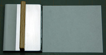 Measure the size of sandpaper needed for the block.