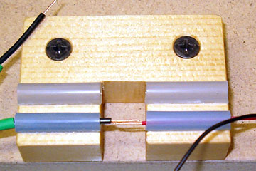 Strip the wires and slide them into the jig.