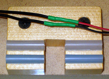 Heat shrink tubing protects the solder joints and prevents shorting of the wires.