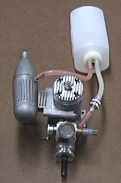 A two-line fuel tank system attached to a model airplane engine.