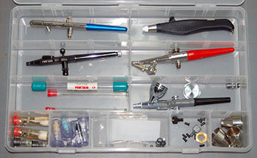 Multi-Compartment bait box for storing airbrushes.