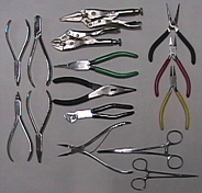 Various pliers and metal-working tools.